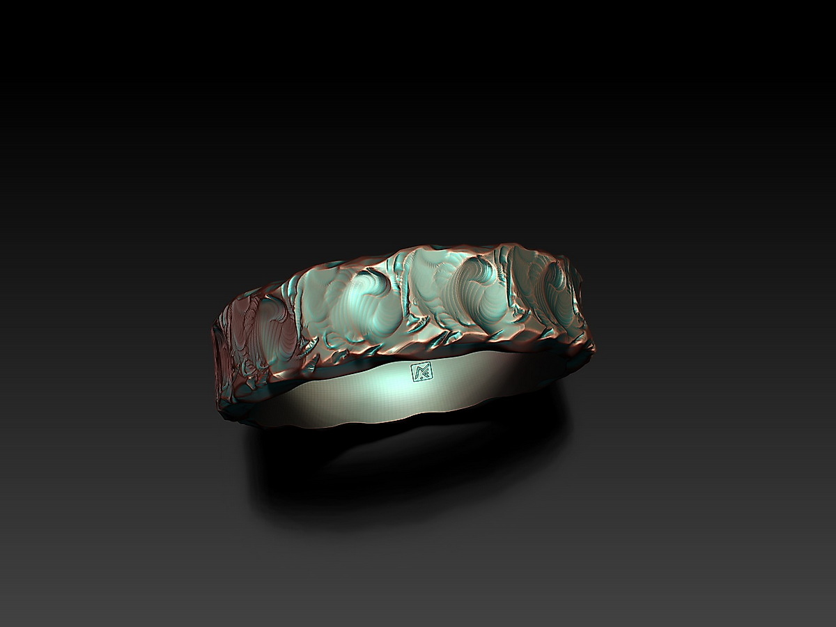 Close view of Rock and Wave Ring showing the rough sculptural exterior, smooth inner surface, and MF maker's mark